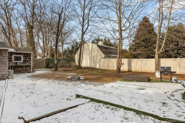 a view of a yard covered in snow
