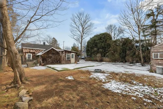 a view of a house with snow on the road