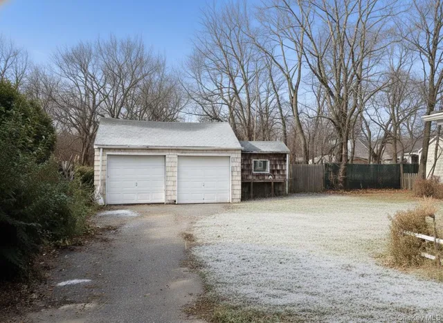a view of a house with a yard and garage