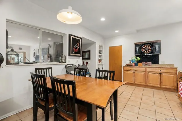 a large kitchen with a table and chairs
