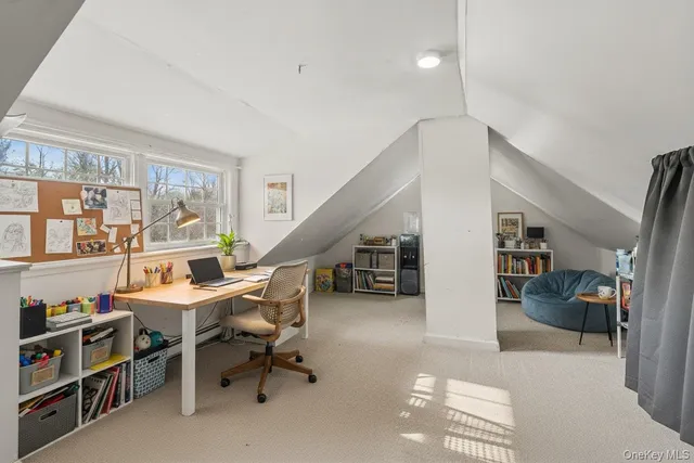a view of a livingroom with furniture and an empty room