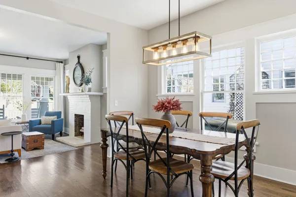a view of a dining room with furniture window and wooden floor