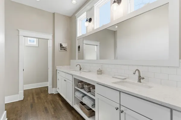 a bathroom with a sink and a mirror