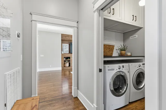 a view of a hallway with washer and dryer
