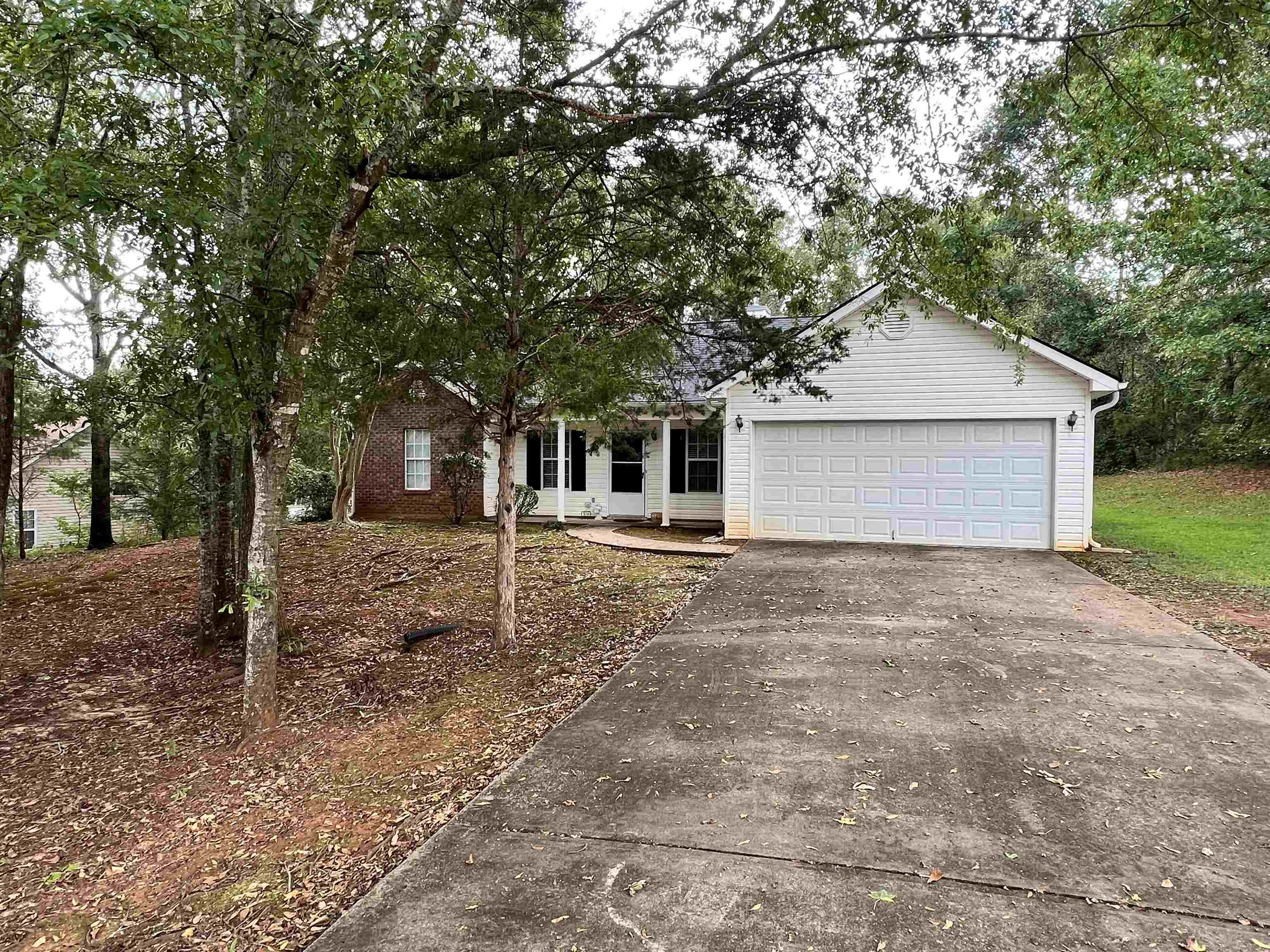 217 Seminary Ridge Griffin, GA 30224 - Photo 1 of 1 a front view of a house with a yard and garage