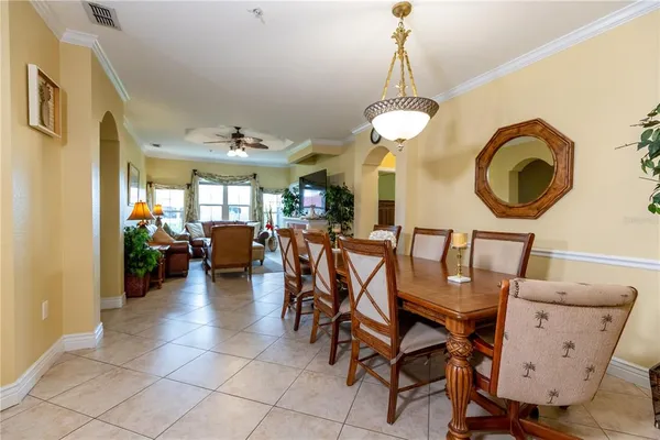 a living room with furniture and a lamp