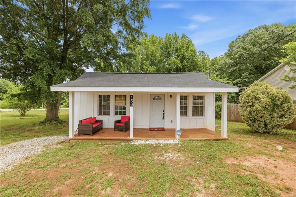 156 Pine Avenue Commerce, GA 30529 - Photo 3 of 35 a front view of house with yard