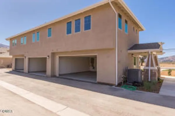 a front view of a house with yard