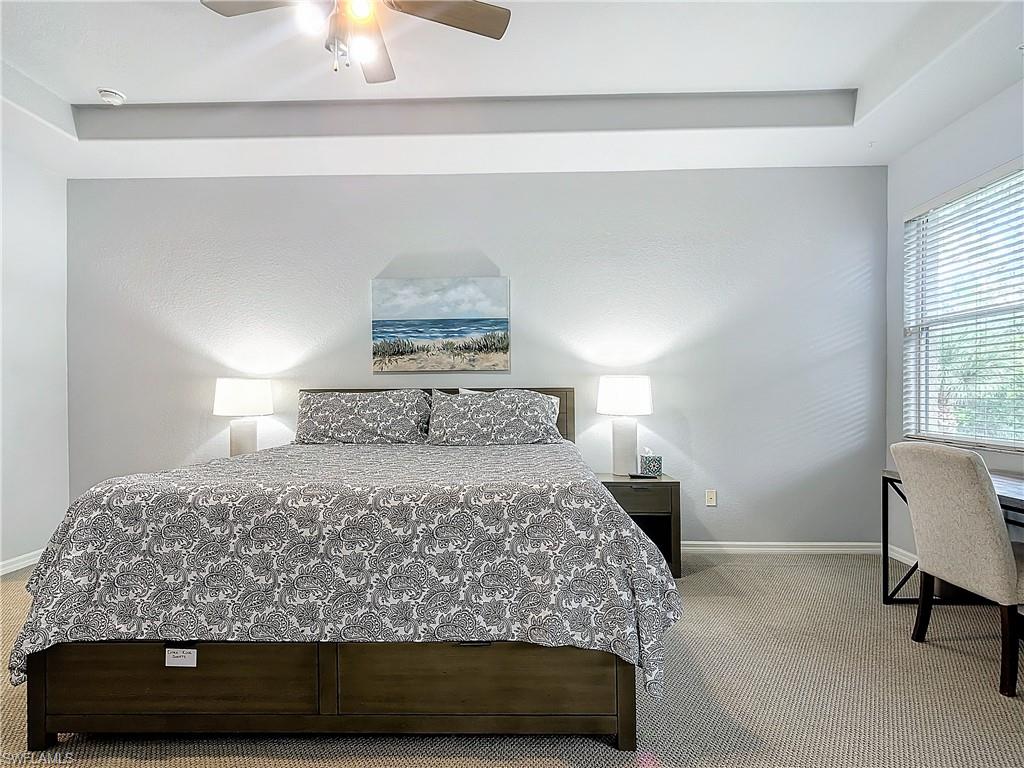 12854 Carrington Circle, Unit 204 Naples, FL 34105 - Photo 18 of 37 a bedroom with a bed and window