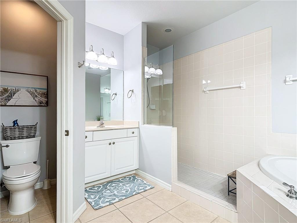 12854 Carrington Circle, Unit 204 Naples, FL 34105 - Photo 19 of 37 a bathroom with a sink a toilet and shower