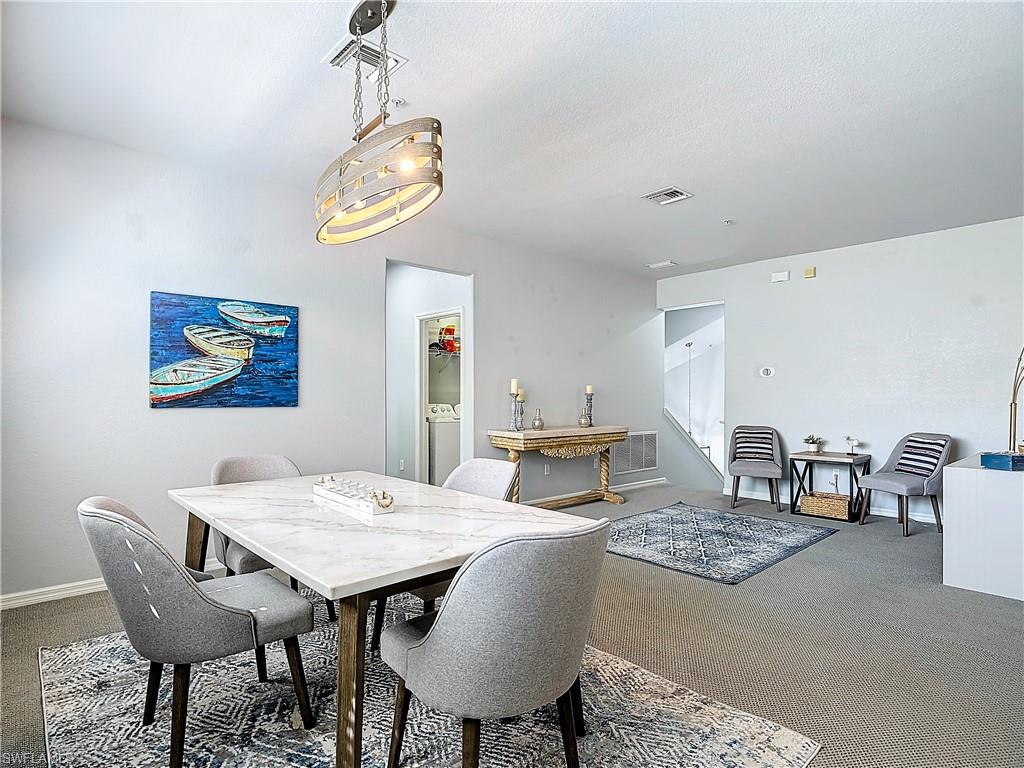 12854 Carrington Circle, Unit 204 Naples, FL 34105 - Photo 2 of 37 a view of a dining room with furniture