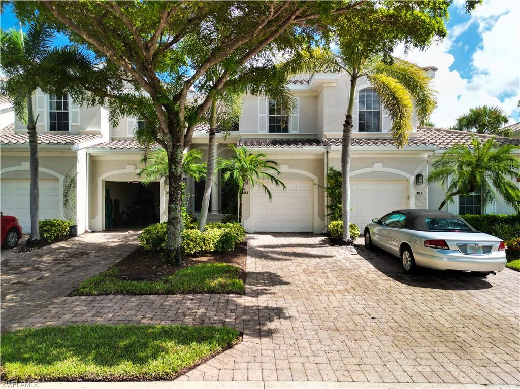 12854 Carrington Circle, Unit 204 Naples, FL 34105 - Photo 30 of 37 a car parked in front of a house