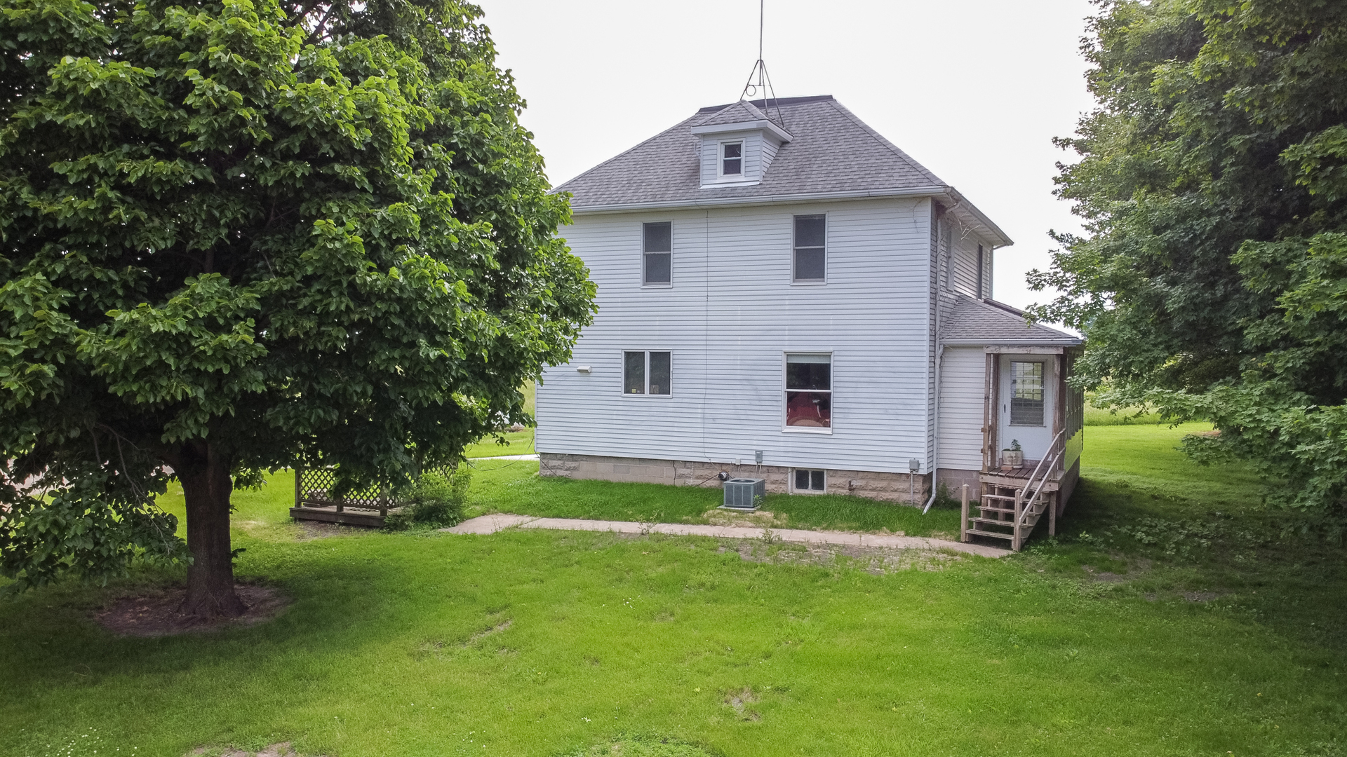 6135 Base Line Road Kirkland, IL 60146 - Photo 30 of 48 a view of a house with a yard