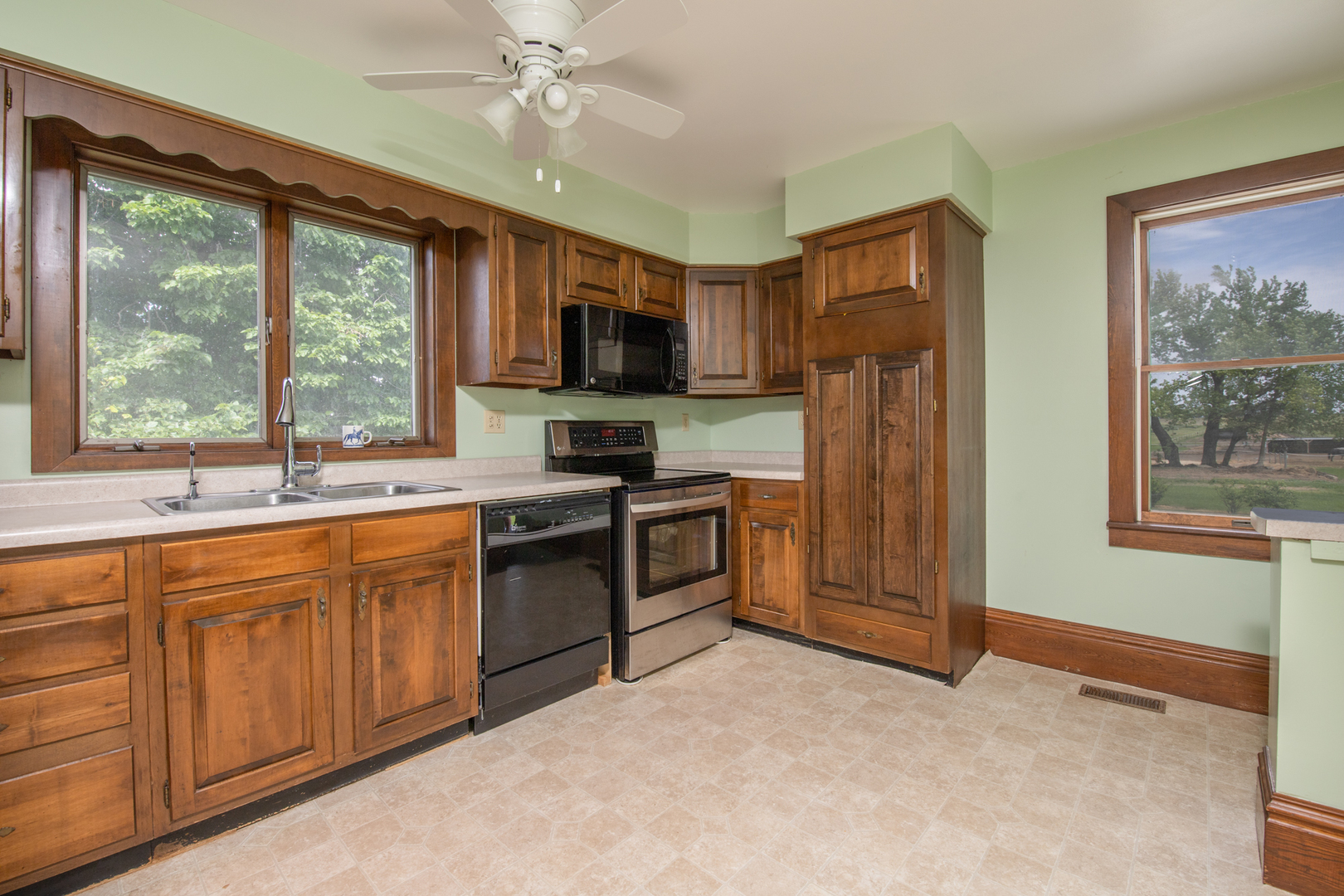 6135 Base Line Road Kirkland, IL 60146 - Photo 33 of 48 a kitchen with stainless steel appliances granite countertop a stove a sink dishwasher a refrigerator and a microwave oven