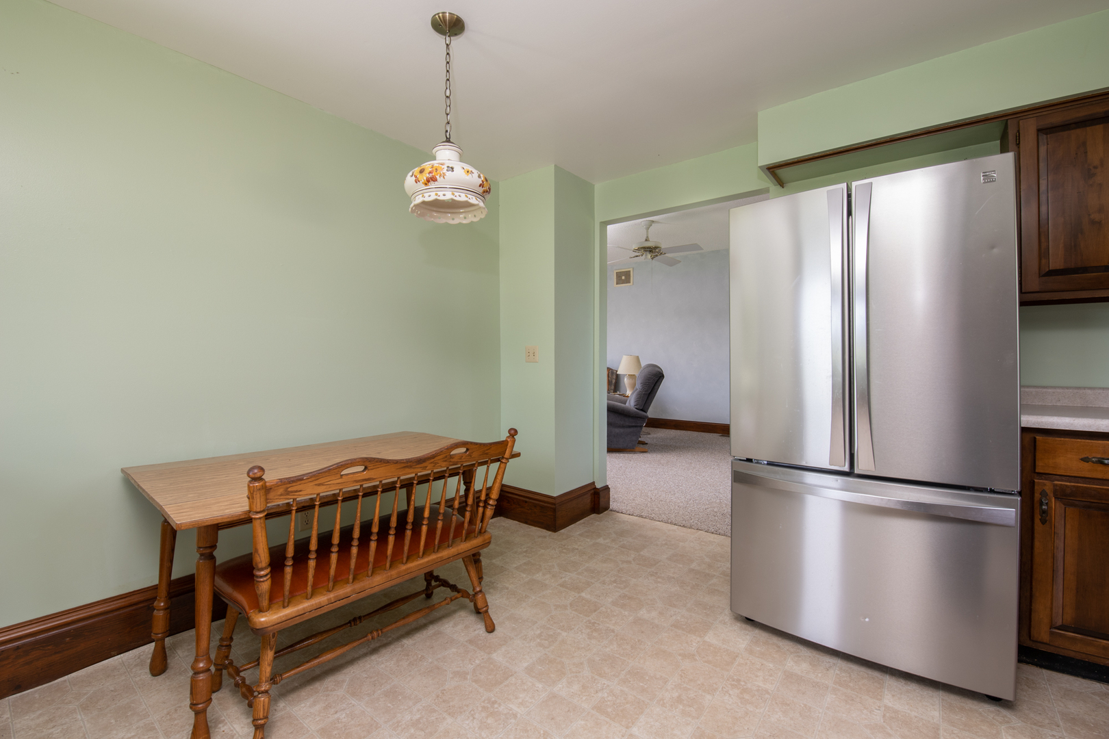 6135 Base Line Road Kirkland, IL 60146 - Photo 35 of 48 a bedroom with a bed and a refrigerator
