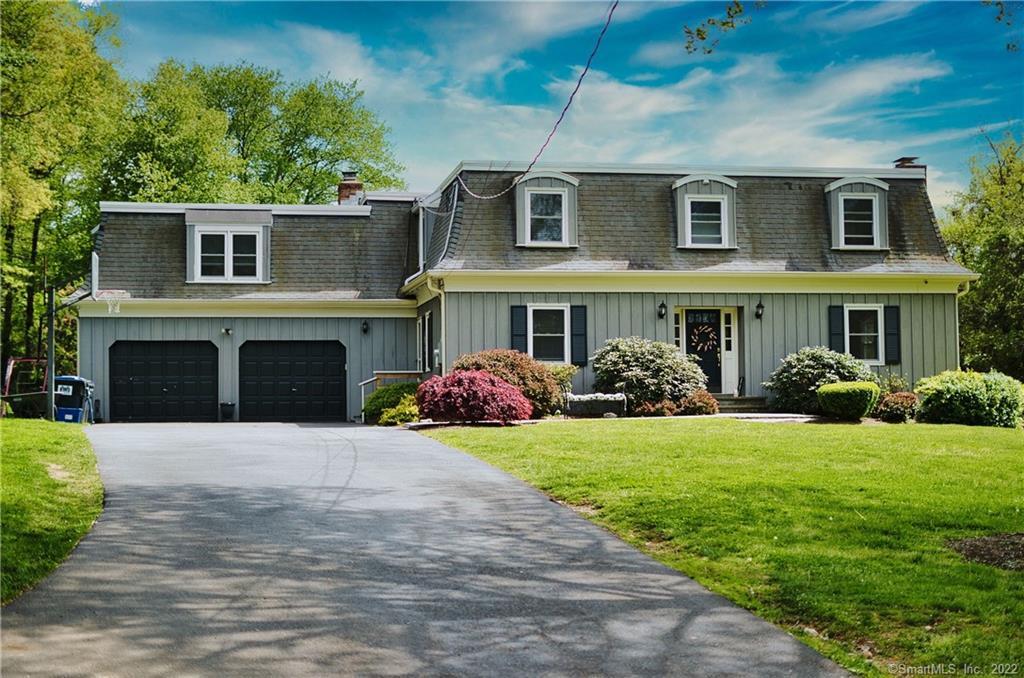 79 Under Cliff Road Trumbull, CT 06611 - Photo 1 of 1 a front view of a house with yard and green space