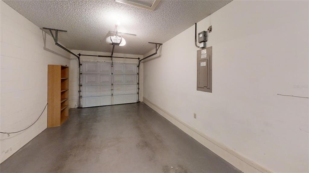 8592 Southwest 91 Street, Unit E Ocala, FL 34481 - Photo 19 of 20 a view of a garage