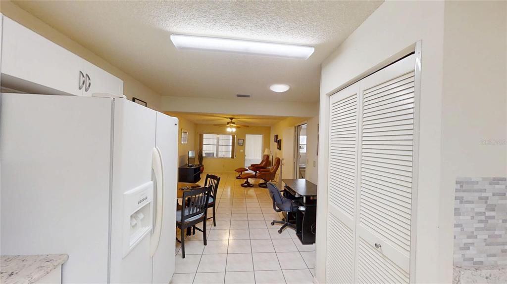8592 Southwest 91 Street, Unit E Ocala, FL 34481 - Photo 8 of 20 a view of living room with furniture and white walls