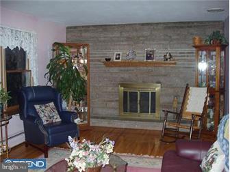 62 Bayberry Road Ewing, NJ 08618 - Photo 7 of 11 a living room with furniture and a fireplace