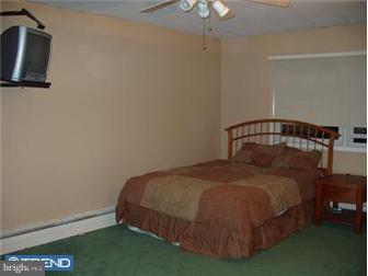 62 Bayberry Road Ewing, NJ 08618 - Photo 9 of 11 a bedroom with a bed and a table