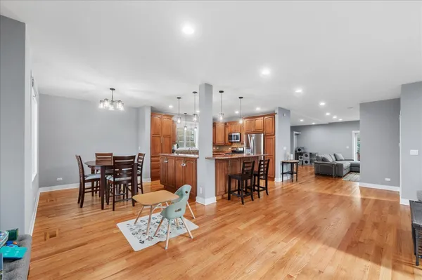 a living room with lots of furniture and kitchen view