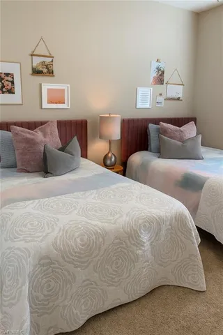 a large white bed in a white room