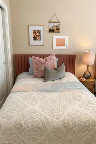 a large white bed in a white room
