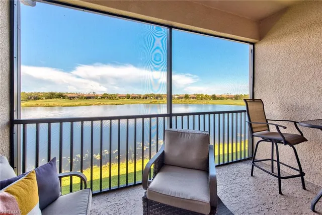 a view of a balcony with furniture