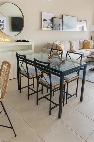 a view of a dining room with furniture and a rug