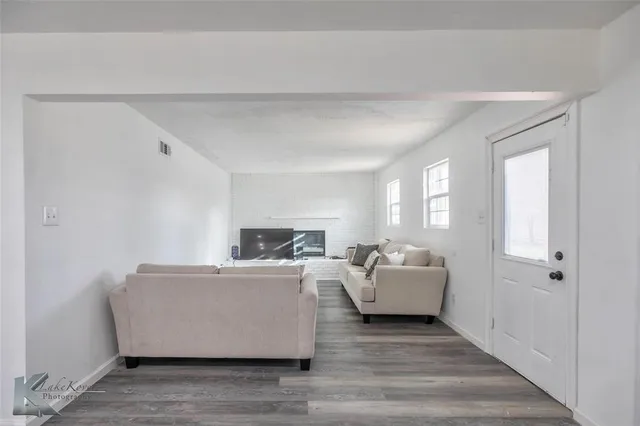 a living room with a couch and a window