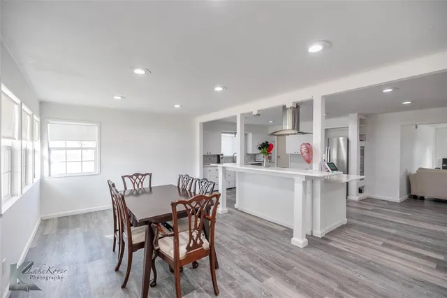 a view of kitchen with cabinets and wooden floor