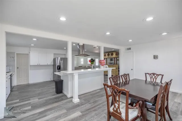 a kitchen with a table and chairs in it