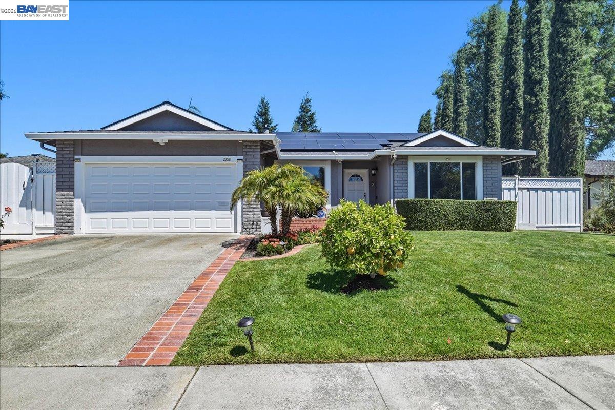 2861 Millbridge Place San Ramon, CA 94583 - Photo 1 of 58 a front view of a house with a yard and garage