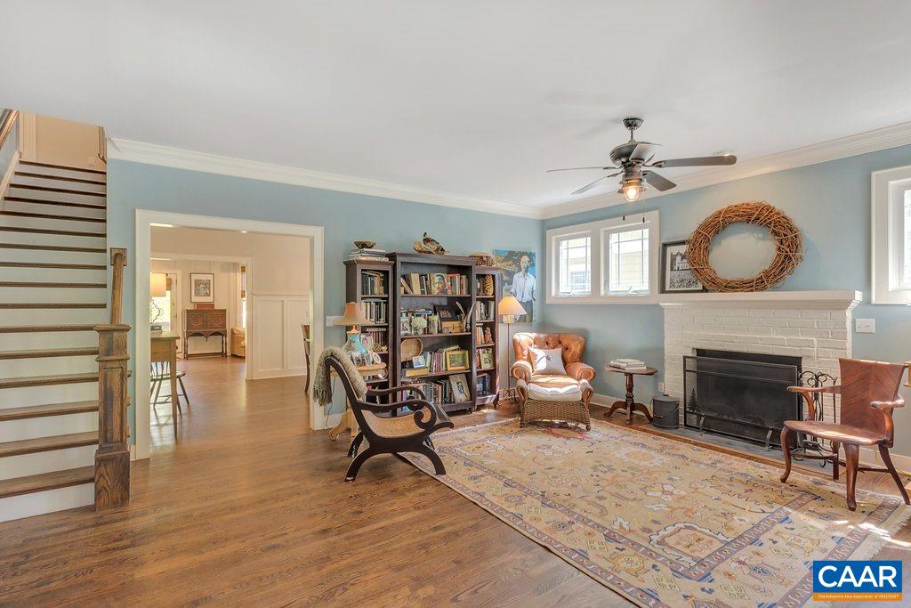 831 Village Road Charlottesville, VA 22903 - Photo 8 of 43 a living room with furniture and a fireplace