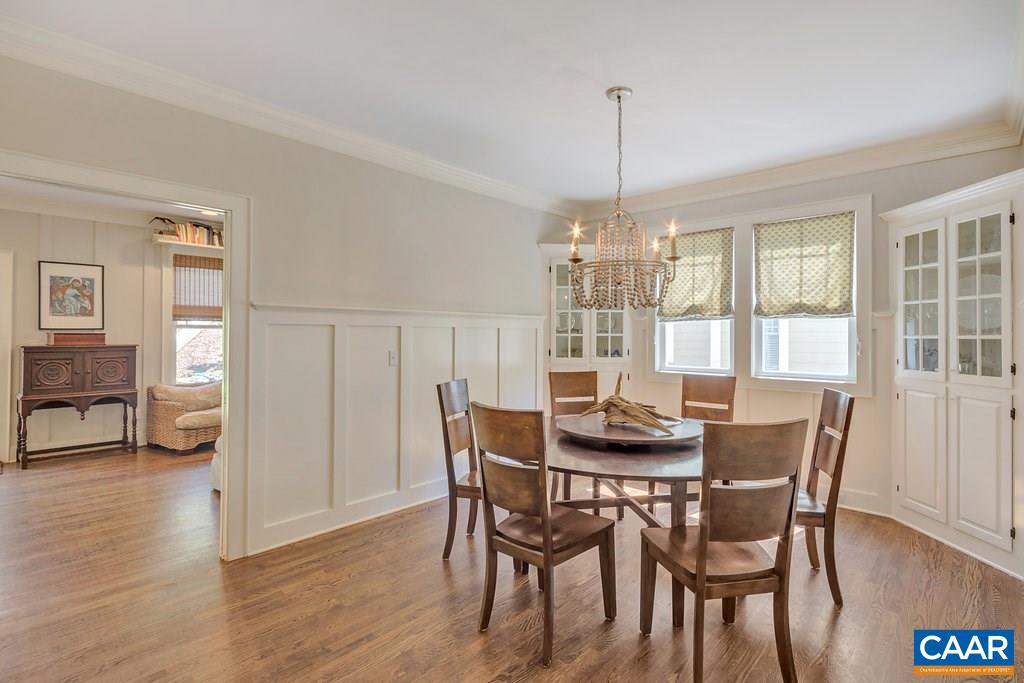 831 Village Road Charlottesville, VA 22903 - Photo 9 of 43 a dining room with furniture window and wooden floor