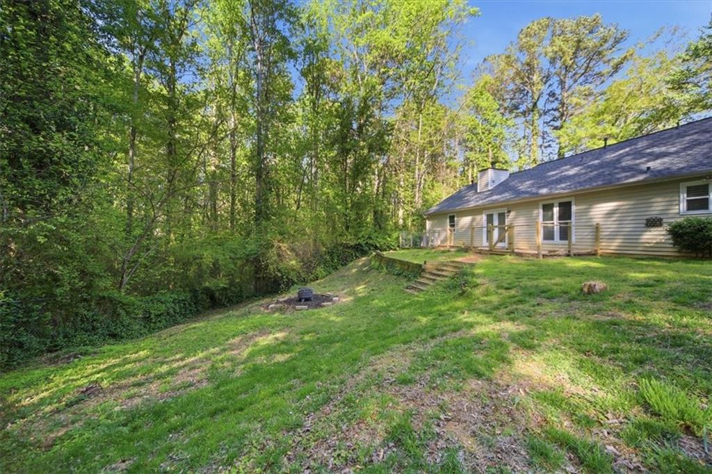8068 Whitney Court Canton, GA 30115 - Photo 28 of 32 a house view with a garden space
