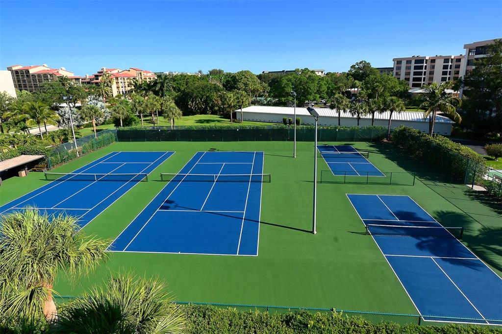 8764 Midnight Pass Road, Unit A306 Sarasota, FL 34242 - Photo 16 of 53 a view of yard with swimming pool and green space