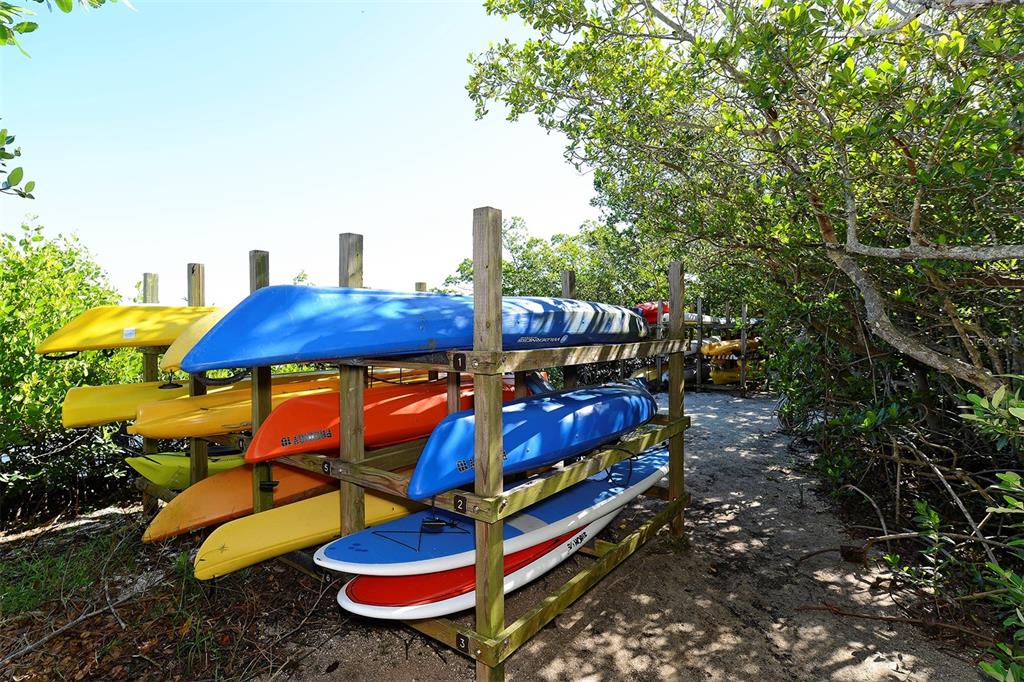 8764 Midnight Pass Road, Unit A306 Sarasota, FL 34242 - Photo 21 of 53 a view of an outdoor sitting area with golf course