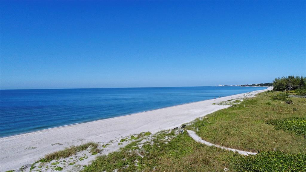 8764 Midnight Pass Road, Unit A306 Sarasota, FL 34242 - Photo 30 of 53 a view of an ocean beach