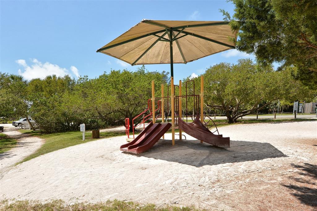 8764 Midnight Pass Road, Unit A306 Sarasota, FL 34242 - Photo 40 of 53 a view of a park with slide