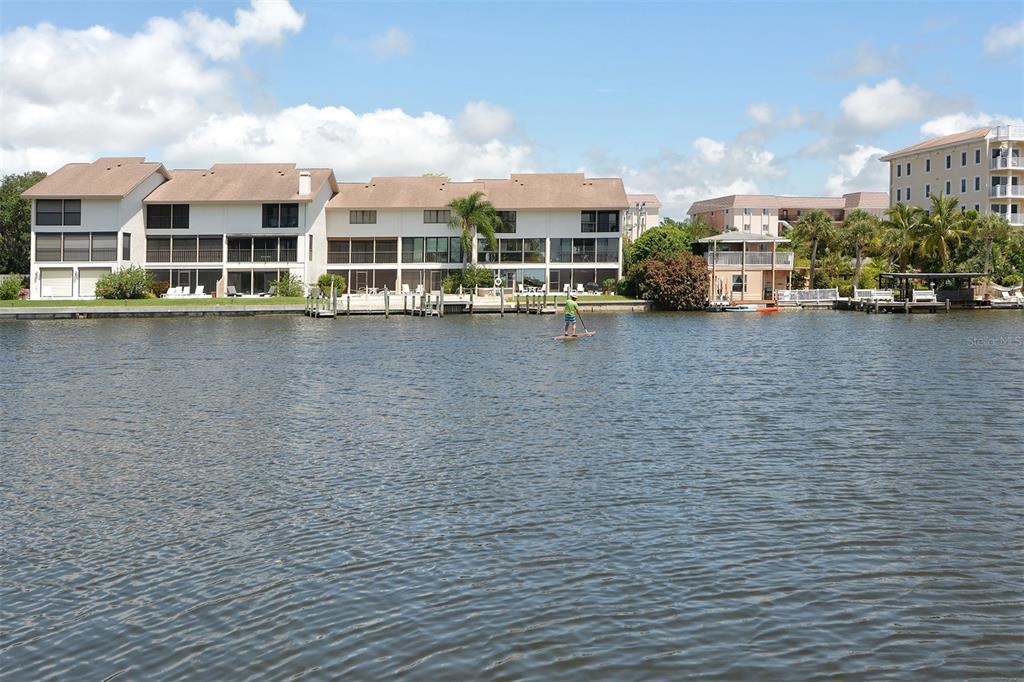 8764 Midnight Pass Road, Unit A306 Sarasota, FL 34242 - Photo 46 of 53 an aerial view of a building with lake view