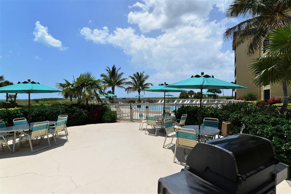 8764 Midnight Pass Road, Unit A306 Sarasota, FL 34242 - Photo 8 of 53 a view of a backyard with sitting area
