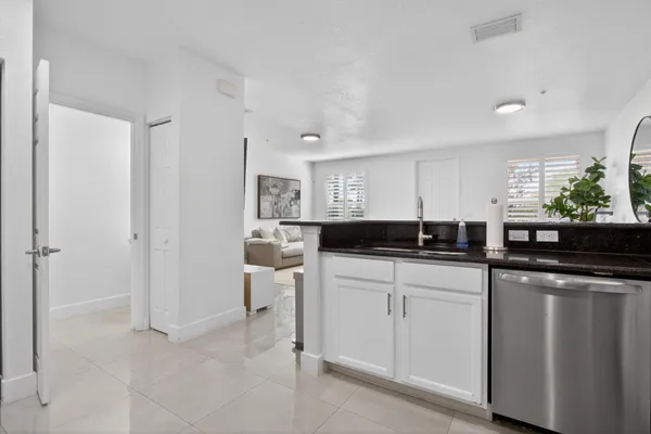 a kitchen with a sink and cabinets