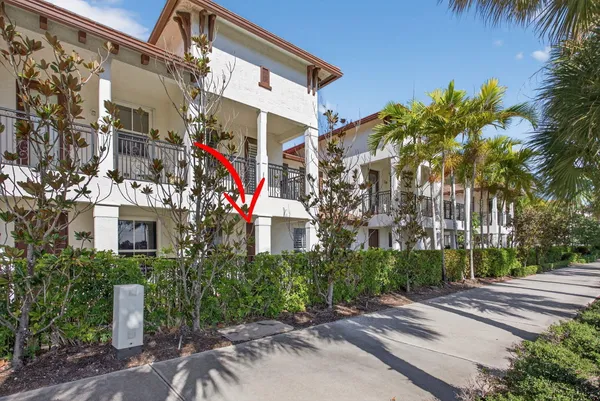 a front view of a building with tree s