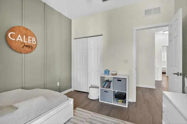 a bedroom with a bed and a table