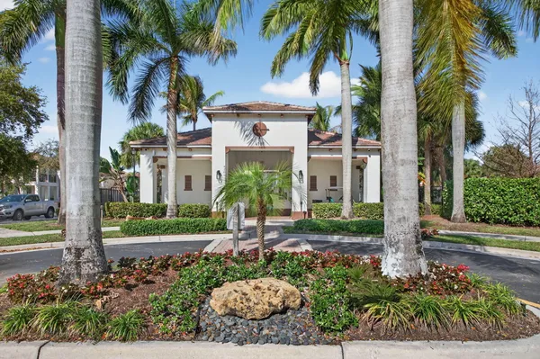 a front view of a house with garden and porch
