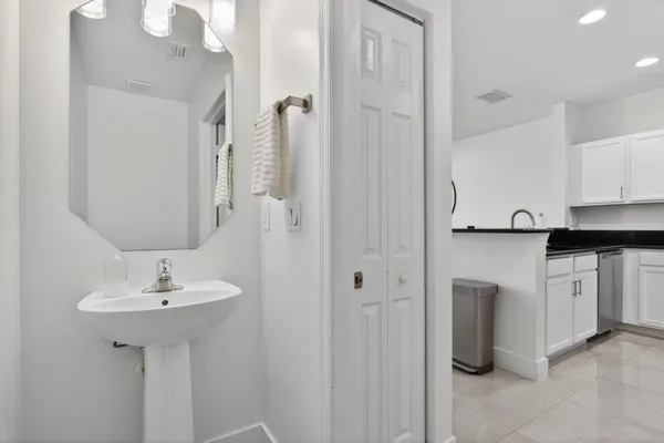 a bathroom with a sink and a mirror