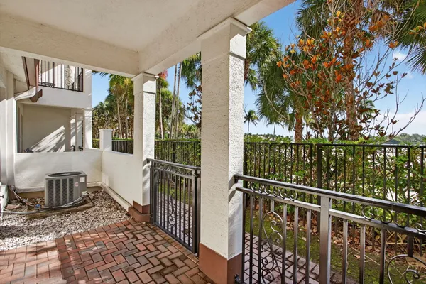 a view of a balcony with furniture