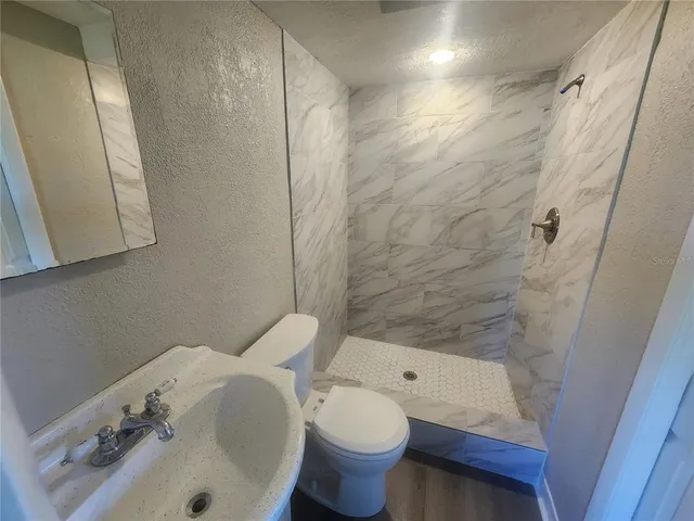 a bathroom with a sink and toilet