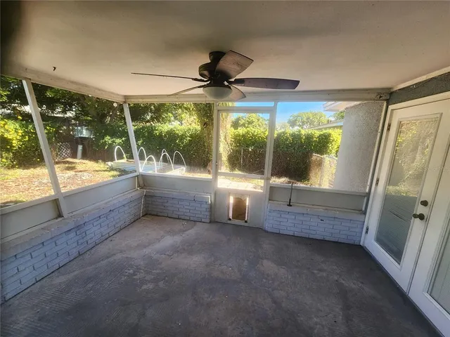 a view of a room with window wooden floor and outdoor space